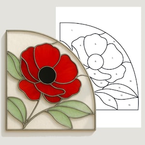May include: A stained glass pattern featuring a red poppy flower with green leaves and a black centre. The design is set within a curved, rectangular frame. The text "SGP STAINED GLASS PATTERNS" is at the top.
