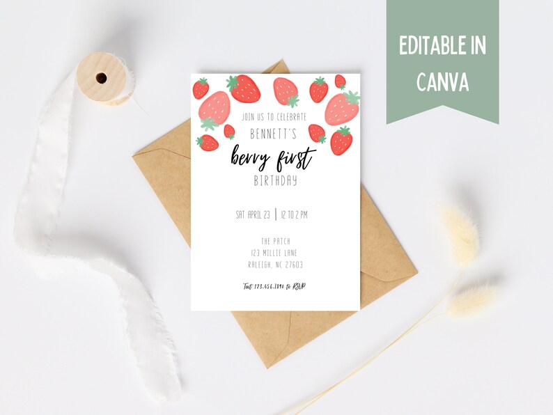 May include: A white invitation card with red strawberry illustrations and the text "berry first birthday". The card is on a brown envelope, with a ribbon and decorative elements. The text "Editable in Canva" is also present.