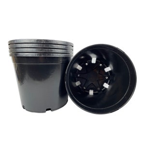 May include: A set of four black plastic plant pots. The pots are stacked on top of each other. The pot on the bottom has drainage holes.