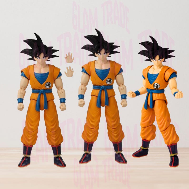 Może przedstawiać: Trzy figurki akcji postaci z serii anime Dragon Ball. Figurki ubrane są w pomarańczowe i niebieskie stroje z czarnymi włosami. Jedna figurka ma dodatkową parę rąk. Figurki są ustawione w r&oacute;żnych pozach.