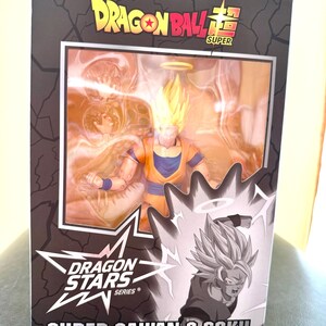 Puede incluir: Figura de acci&oacute;n de Dragon Ball Super en caja. La figura es de Super Saiyan 2 Goku, con pelo amarillo puntiagudo y un atuendo naranja y azul. La caja tiene el logotipo de Dragon Ball Super y la marca Dragon Stars Series.