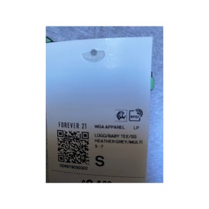 May include: A white tag with black text and a barcode. The tag reads "FOREVER 21 WGA APPAREL LP LOGO/BABY TEE/SS HEATHER GREY/MULTI 9-F S 004919090302"