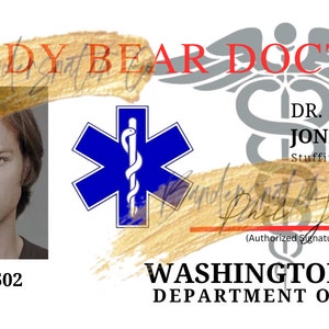 May include: A Teddy Bear Doctor ID card featuring a man's photo, a blue Star of Life symbol, and the text "TEDDY BEAR DOCTOR", "DR. PHIL JONES", "Stuffingologist", "11-83-0502", "(Authorized Signature)", "WASHINGTON STATE DEPARTMENT OF HEALTH".