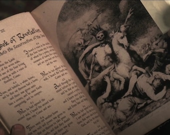 May include: An open book with a black and white illustration of a skeletal figure riding a horse. The book is titled "The Book of Revelation" and has text about the resurrection of the land.