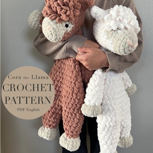 May include: A crochet pattern for Cora the Llama and a white crochet sheep. The pattern is available in PDF format and is written in English.