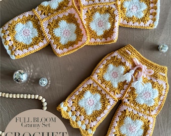 May include: A crochet granny set in mustard yellow, white, and pink, featuring a floral pattern. The set includes a top and shorts, with a drawstring on the shorts. The image also shows decorative beads and disco balls. Text on the image reads "FULL BLOOM Granny Set CROCHET PATTERN".