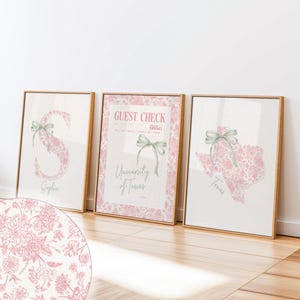 May include: Three framed prints with gold frames. One features the letter "S" with a floral design and the name "Sophia". Another is a "Guest Check" from the "University of Texas". The third is a floral Texas state map.