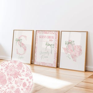 May include: Three framed wall art prints featuring a pink floral pattern. The left print shows the letter S with the name Sophia. The centre print is a guest check for the University of Texas. The right print shows the state of Texas.
