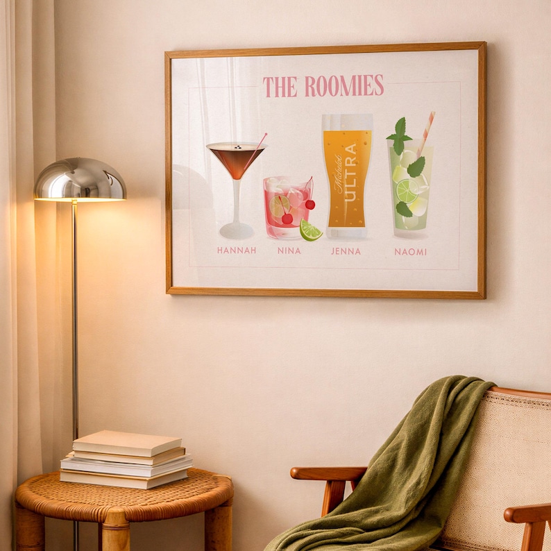 May include: A framed wall art print titled THE ROOMIES featuring four illustrated drinks labeled Hannah, Nina, Jenna, and Naomi. The artwork displays a martini, a cocktail with cherries and lime, a beer glass labeled Michelob ULTRA, and a mojito.