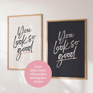 May include: Two framed art prints with the phrase "You look so good" in a handwritten style. One print has a white background with black text and a pink underline, the other has a black background with white text and a pink underline.