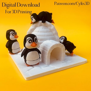 May include: A 3D-printed penguin family scene with an igloo. The penguins are black and white with orange beaks and feet. The igloo is white. The text "Digital Download For 3D Printing" is at the top left.