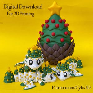 May include: A 3D-printed Christmas tree and dragon figurines. The tree is green with red ornaments and a yellow star. The dragons are white with green and yellow accents. Text reads "Digital Download For 3D Printing" and "Patreon.com/Cylix3D".