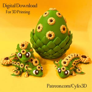 May include: A green 3D-printed dragon egg and two dragon figures, decorated with yellow and brown sunflowers. The egg sits in a green base. The text "Digital Download For 3D Printing" and "Patreon.com/Cylix3D" are visible.