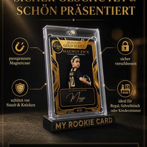 May include: A clear magnetic protective case holding a gold and black sports trading card featuring a young soccer player named Magnus Eick. The card displays the text Signature Gold Series, My Rookie Card, and an authentic signature by Maggi.