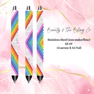 May include: Three rainbow-colored pens with a white background and black accents. The pens are made of stainless steel and are 12 inches across and 45 inches tall. The text on the pens reads "Beauty & The Bling Co."