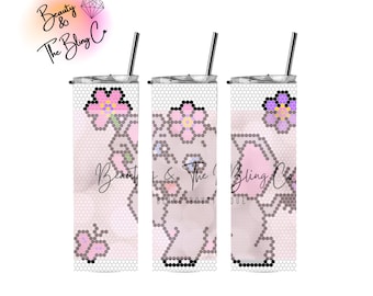 May include: Three stainless steel tumblers featuring a pink and purple elephant design with flowers. The tumblers have a clear, textured surface and a straw.