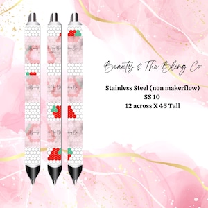 May include: Three black and silver pens with a white and pink geometric design. The pens have a red and green design on the barrel. The text "Beauty & The Bling Co" is printed on the pens. The pens are 12 inches across and 45 inches tall.