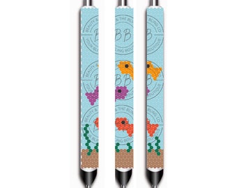May include: Three pens with a light blue background and white polka dots. Each pen features a floral design with the text "BEAUTY & THE BLING CO BOUTIQUE". The pens have black tips and silver accents.