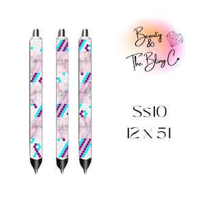 May include: Three silver pens with a white, pink, and purple geometric pattern. The pens have the text "Beauty & The Bling Co." printed on them. The text "SS10 12 x 51" is also visible in the image.