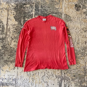 May include: A set of three ceramic canisters with lids, featuring a blue and white floral pattern. The canisters vary in size, with the largest measuring approximately 8 inches in height. They are likely used for kitchen storage.