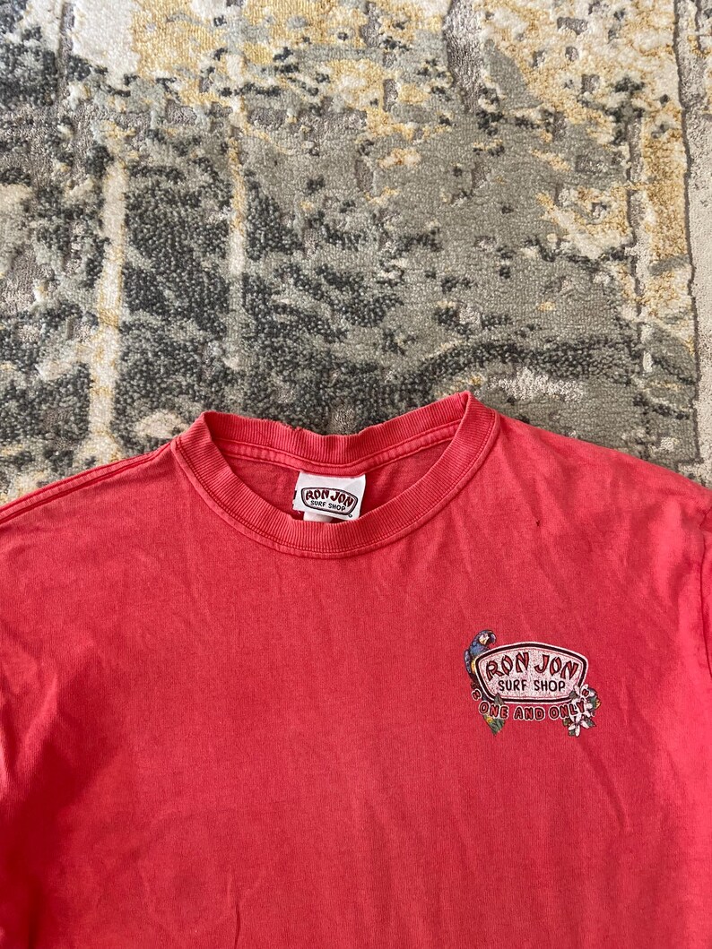 May include: A rustic wooden sign with the text "Welcome to our home" in a handwritten style. The sign is rectangular, with a distressed finish, and features a simple, inviting design. It's suitable for indoor or outdoor use.