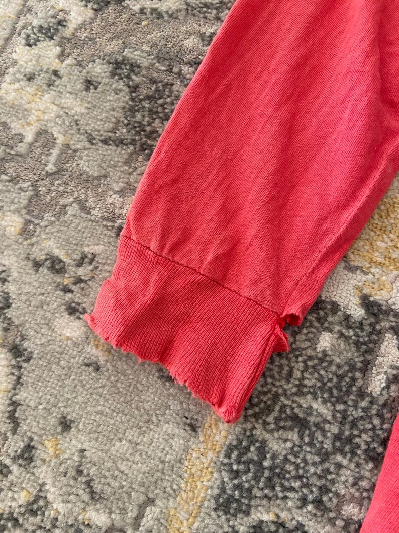 May include: A rustic wooden sign with the text "Welcome to our home" in white lettering. The sign features a distressed finish and a simple, inviting design, perfect for entryway decor.