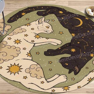 May include: A round rug with a green background featuring two stylized cats with a constellation pattern. The cats are white and black with gold stars and clouds. The rug has a whimsical and celestial theme.
