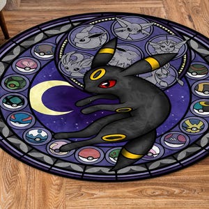 May include: A round, purple and black rug with a stained glass design featuring a black and yellow Pokemon character, surrounded by smaller Pokemon characters and Pokeballs.