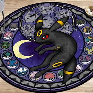 May include: A round, purple and black rug with a stained glass design featuring a black Pokemon character with yellow accents. The character is surrounded by smaller, colorful Pokemon characters.