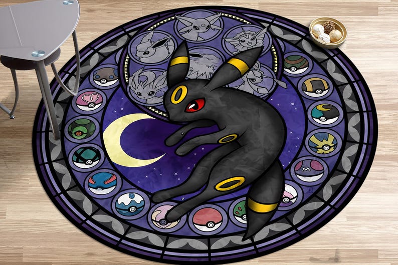 May include: A round, purple and black rug with a stained glass design featuring a black Pokemon character with yellow accents. The character is surrounded by smaller, colorful Pokemon characters.