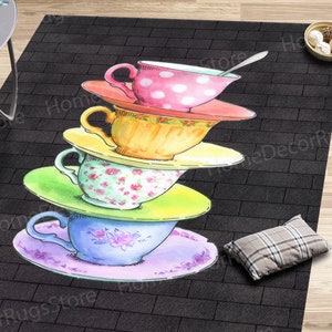 May include: A stack of four teacups and saucers with floral and polka dot patterns on a black brick background.