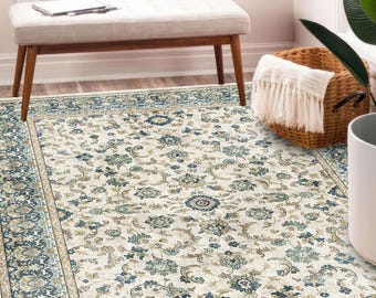Ivory floral area rug, vintage washable carpet with teal blue border, Kurdish style rug for bedroom, living room or entryway