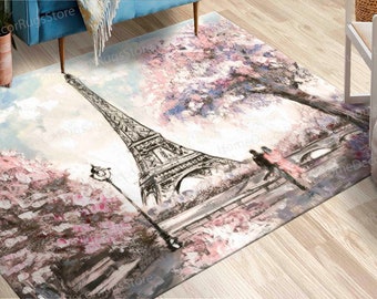 May include: A watercolor painting of the Eiffel Tower in Paris, France. The tower is depicted in black and white, while the background features pink and blue watercolor washes. Two figures are walking in the foreground, and the painting is set against a light blue sky.