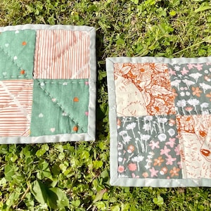Hand-quilted mug rugs set of 2 - coasters - candle mats - checkers nature animals flowers green blue tan
