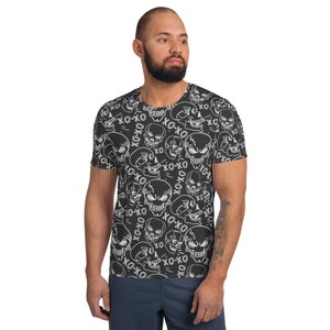 May include: A black t-shirt with a white skull and crossbones pattern. The skulls have the words "XO-XO" written on them.