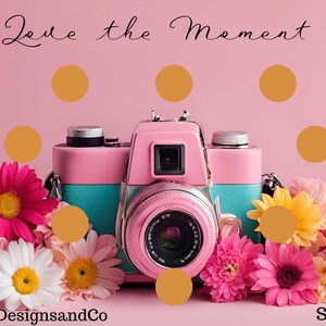 May include: A pink vintage camera with a teal lens sits in front of a bouquet of pink, white, and yellow flowers. The background is a light pink with gold polka dots. The text "Save $75" is in the bottom right corner and "AkieluzDesignsandCo" is in the bottom left corner. The text "Live the Moment" is at the top of the image.