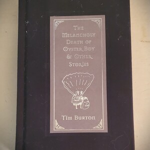 Tim Burton's "The Melancholy Death of Oyster Boy and Other Stories" (1997), vintage book, illustrated book, quirky storybook.