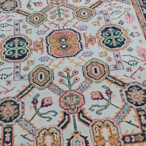 Vintage Heriz Persian Rug | Hand-Knotted Wool Carpet with Bold Geometric Floral Design | Traditional Ivory & Multi-Color Area Rug
