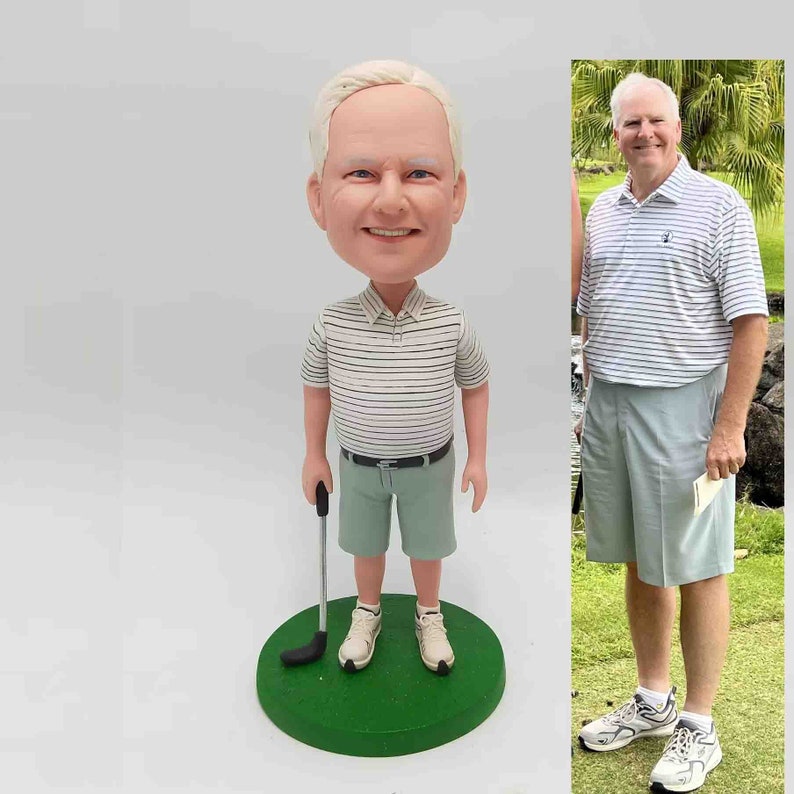 May include: A custom bobblehead figurine of a person wearing a light green and white striped shirt, light green shorts, and white shoes. The figurine holds a golf club and stands on a green base.  A photograph of the same person in similar attire is shown next to the figurine.