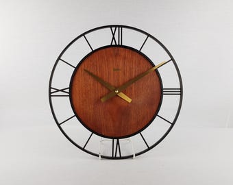 Vintage GARANT Black Kitchen Wall Clock With Wooden Veneer Background West German Pottery 1970s