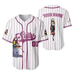 May include: White baseball jersey with vertical purple stripes and the name "Sally" in a cursive font. Features illustrations of Sally from The Nightmare Before Christmas. The back of the jersey has the text "YOUR NAME" and another Sally illustration.