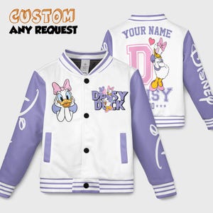 May include: White and lavender varsity jacket featuring Daisy Duck. The jacket has black buttons, lavender sleeves with the word "Disney", and a Daisy Duck graphic on the front and back. The text "CUSTOM ANY REQUEST" is at the top.