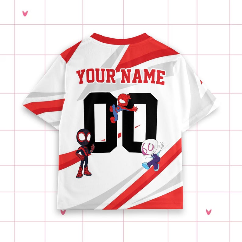 May include: White t-shirt with red detailing and the text "YOUR NAME" in red. The number "00" is in black, with cartoon Spider-Man characters. The shirt has a baseball jersey style.