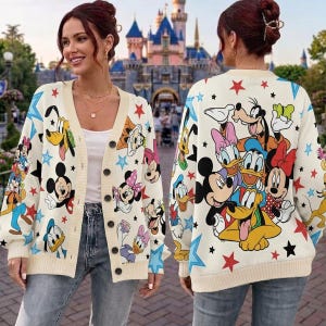 May include: A cream-colored button-down cardigan featuring a repeating pattern of Disney characters including Mickey Mouse, Minnie Mouse, Donald Duck, Daisy Duck, Goofy, and Pluto, accented with scattered red, blue, and black stars throughout.