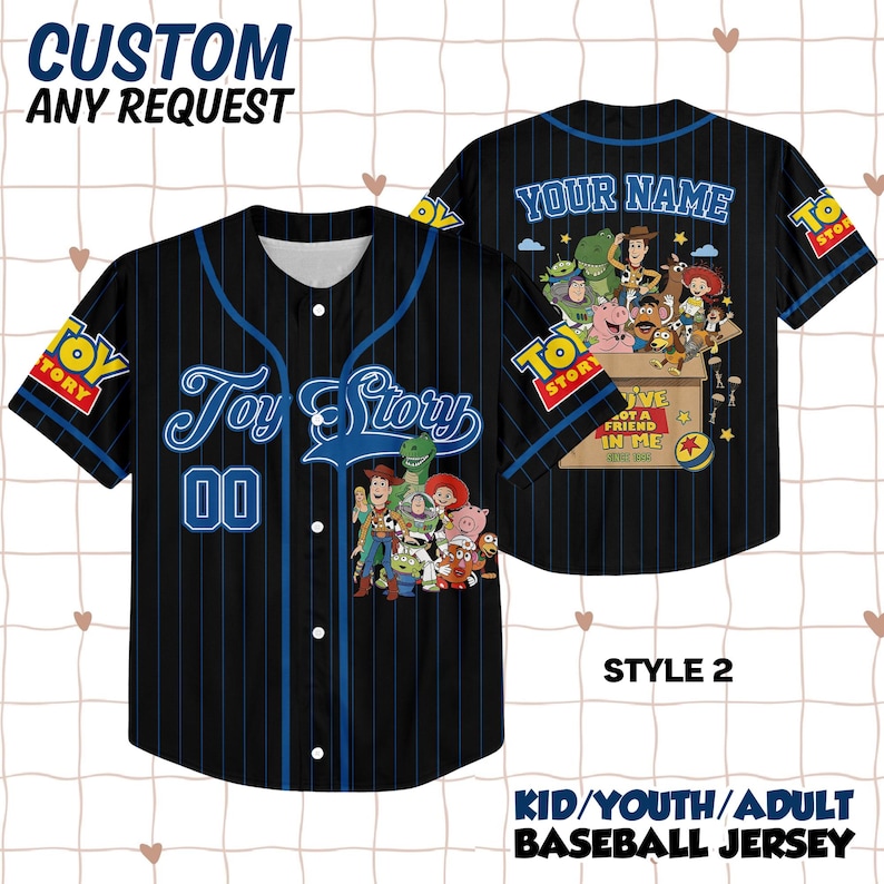 May include: A black baseball jersey with blue pinstripes, featuring Toy Story character graphics, the text Toy Story, 00, Your Name, and You've Got A Friend In Me. The shirt has a button-down front, short sleeves, and Toy Story logos on the sleeves.
