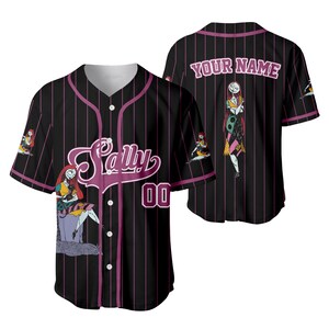 May include: Black baseball jersey with pink pinstripes and the name "Sally" in a script font. The jersey features a cartoon character graphic and the number "00". The back of the jersey has the text "YOUR NAME" and a character graphic.