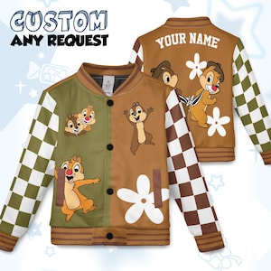 May include: Custom bomber jacket with a split design, featuring cartoon chipmunks and white flower accents. The jacket has a brown and olive green colour scheme with checkered sleeves and the text "CUSTOM ANY REQUEST" at the top.