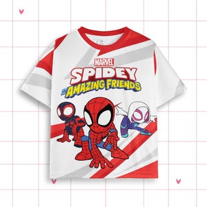 May include: White t-shirt with the Marvel Spidey and His Amazing Friends logo and cartoon illustrations of Spiderman and other characters. The shirt has red and white accents on the sleeves and neckline.