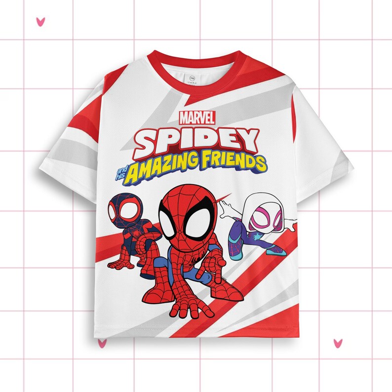 May include: White t-shirt with the Marvel Spidey and His Amazing Friends logo and cartoon illustrations of Spiderman and other characters. The shirt has red and white accents on the sleeves and neckline.