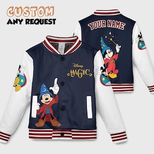May include: Navy blue and white varsity jacket featuring Mickey Mouse in a wizard costume. The jacket has the text "Disney MAGIC" and "YOUR NAME" on the back. The sleeves are white, and the jacket has a red and white striped collar and cuffs. The text "CUSTOM ANY REQUEST" is at the top.